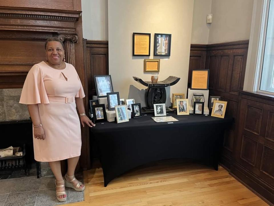 Valerie Scott-Price next to the piece she created for the exhibit that inspired "A Seat at the Table." Her piece will act as the focal point for the exhibit at Port Huron Museums.