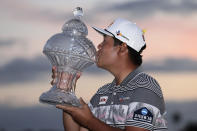 Sungjae Im of South Korea kisses the trophy after winning the Honda Classic golf tournament, Sunday, March 1, 2020, in Palm Beach Gardens, Fla. (AP Photo/Lynne Sladky)