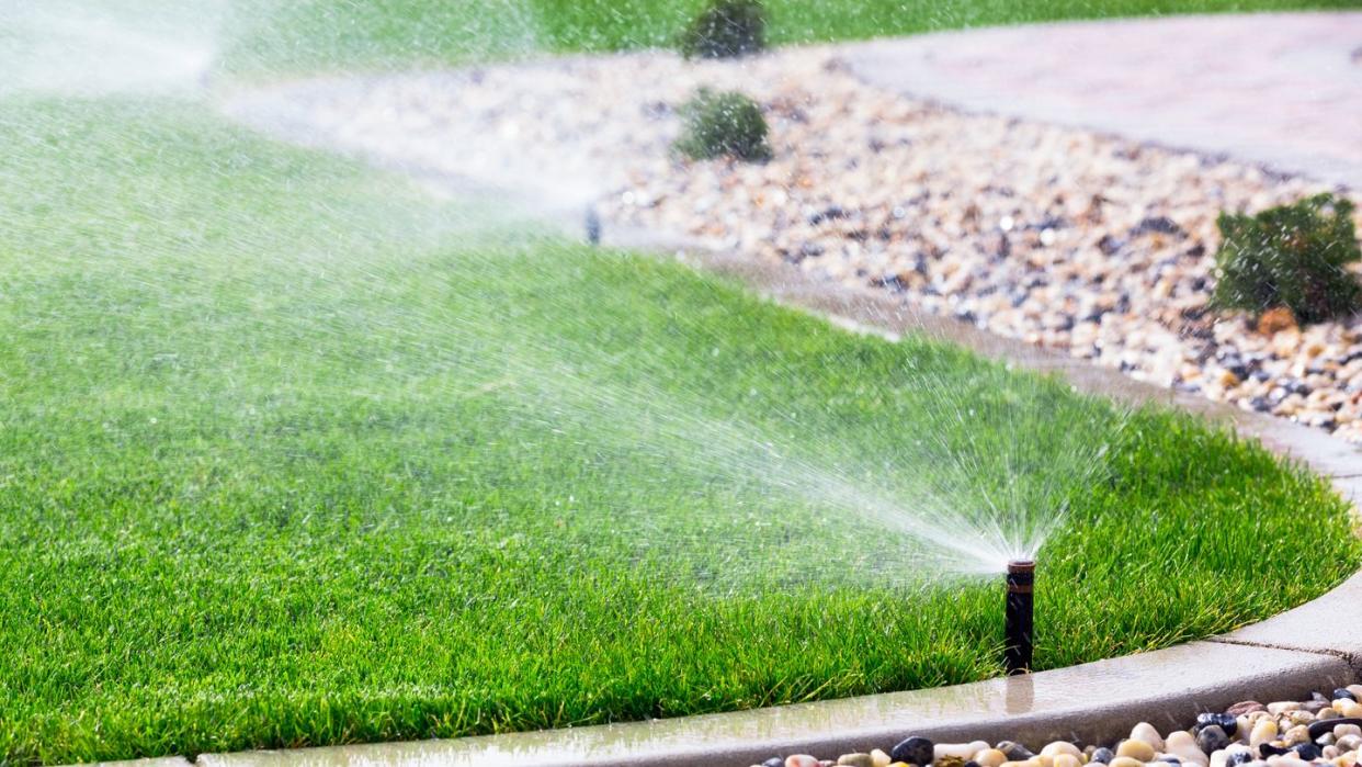 automatic sprinklers watering lawn