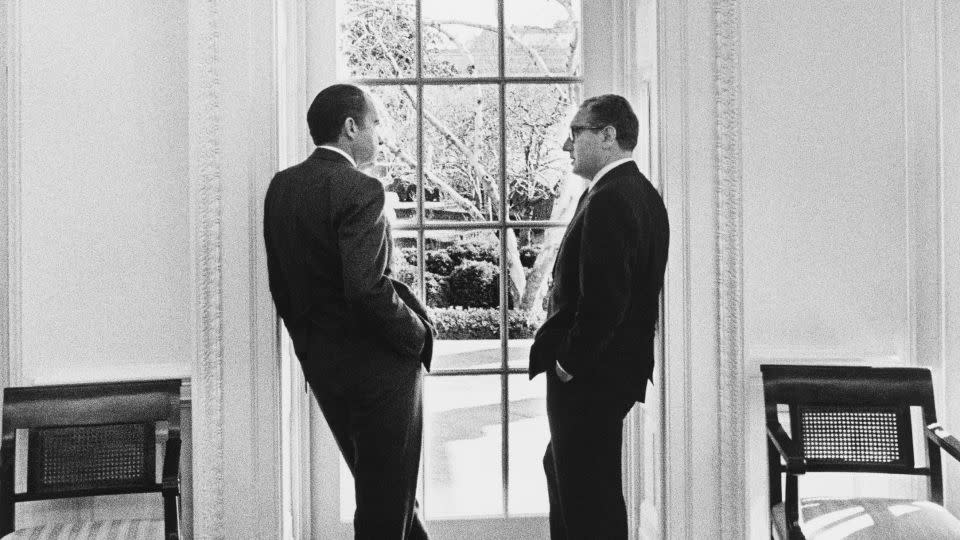 President Richard Nixon and Henry Kissinger stand at an Oval Office window on February 10, 1971. - Richard Nixon Presidential Library and Museum