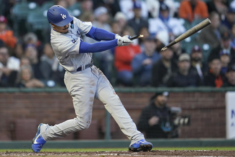 Los Angeles Dodgers' Miguel Vargas breaks his bat on a single that scored Max Muncy during the fourth inning of a baseball game against the San Francisco Giants in San Francisco, Wednesday, Aug. 3, 2022. (AP Photo/Jeff Chiu)
