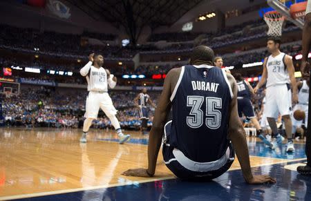 Oklahoma City Thunder forward Kevin Durant (35) picks himself up off the court during the second half against the Dallas Mavericks in game three of the first round of the NBA Playoffs at American Airlines Center. The Thunder defeated the Mavericks 131-102. Mandatory Credit: Jerome Miron-USA TODAY Sports