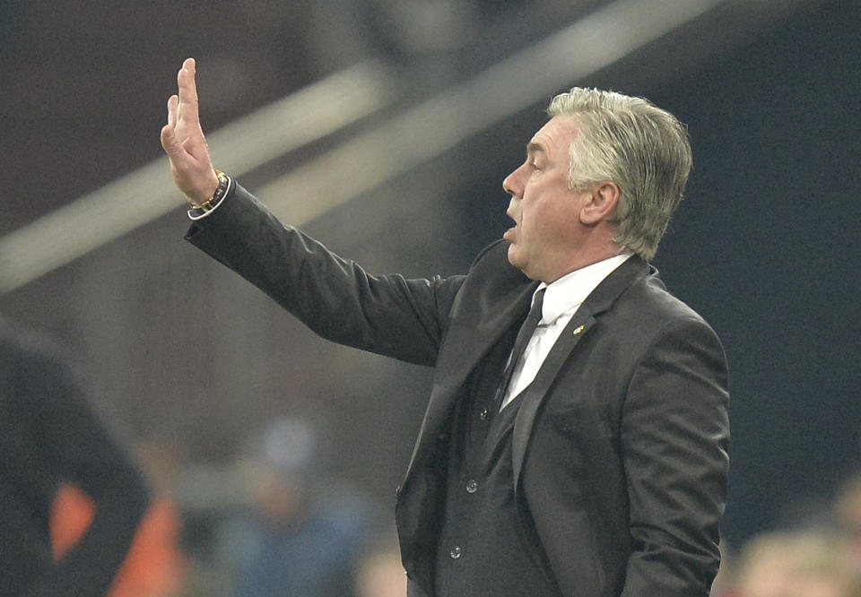 Real's coach Carlo Ancelotti signals during a Champions League round of sixteen, first leg soccer match between Schalke 04 and Real Madrid at the Veltins Arena in Gelsenkirchen, Germany, Wednesday Feb. 26, 2014. (AP Photo/Martin Meissner)