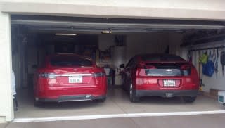 2013 Tesla Model S and 2011 Chevrolet Volt in garage; photo by George Parrott