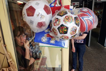 A woman sells souvenirs at Kremlin in Nizhny Novgorod, Russia, June 30, 2018. REUTERS/Damir Sagolj