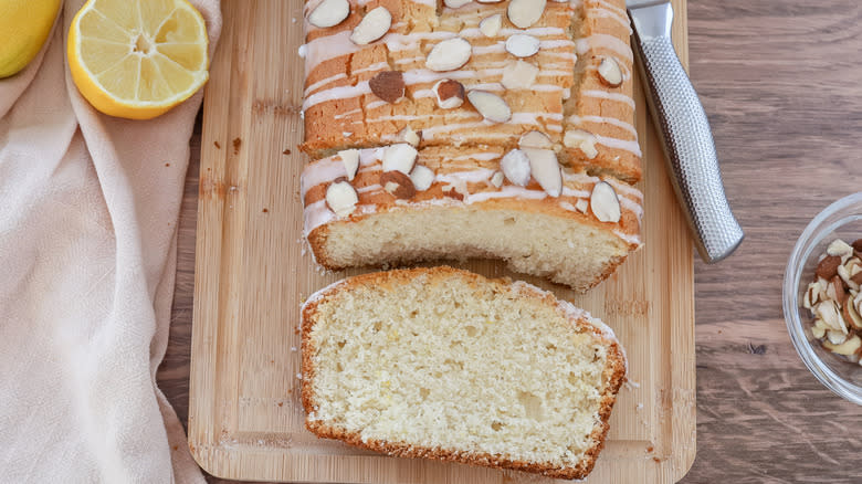 lemon bread on wooden board, slices cut out