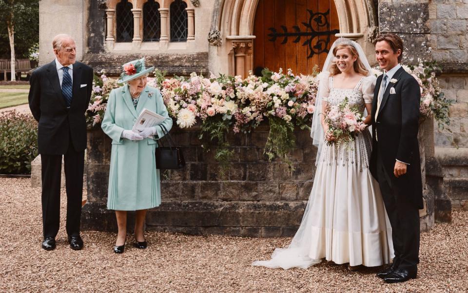 Princess Beatrice wearing her grandmother, the Queen's dress at her wedding last year - Benjamin Wheeler