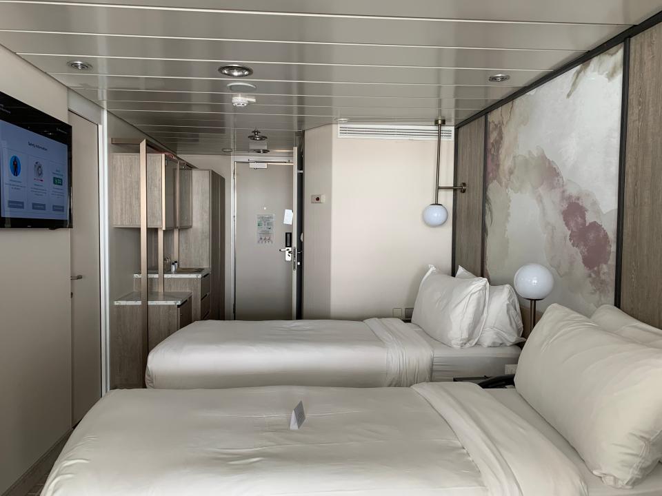 two beds in cruise room with beige walls