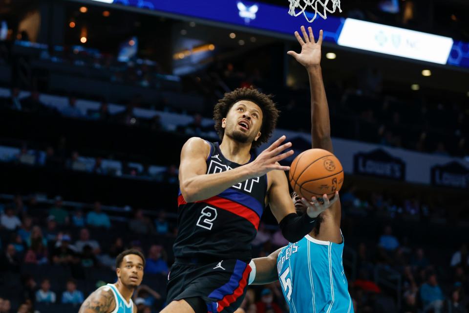 Detroit Pistons guard Cade Cunningham (2) drives to the basket ahead of Charlotte Hornets center Mark Williams, right, during the first quarter at the Spectrum Center in Charlotte, North Carolina, on Friday, Oct. 27, 2023.