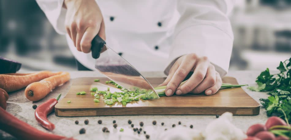 Chef cuts up vegetables