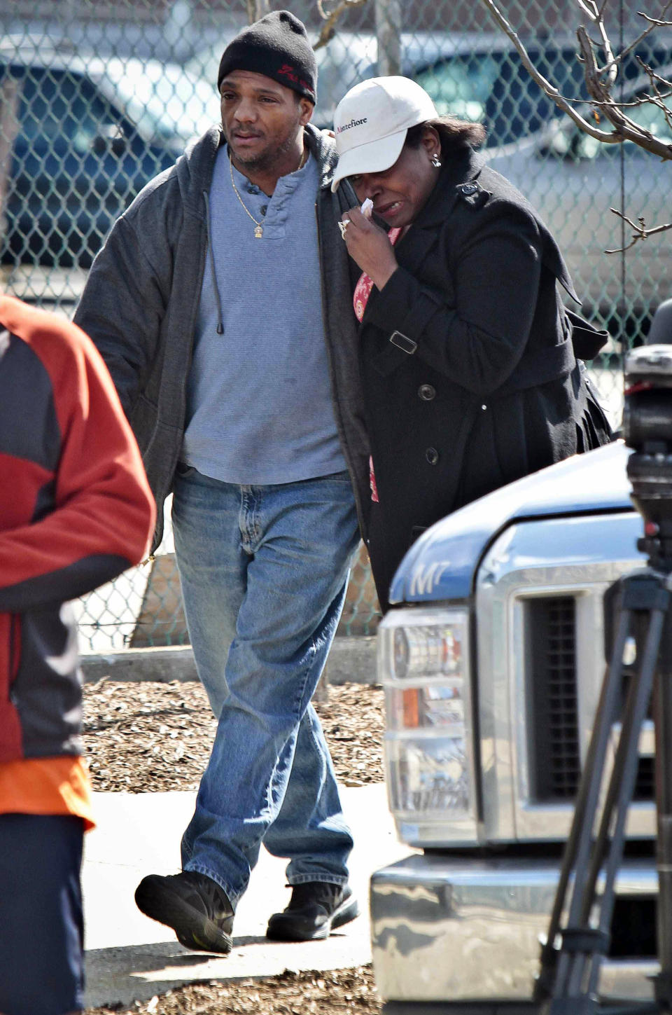 Individuals who identified themselves as family members only, arrive as police recover a 2009 Honda Accord from the Steinway Creek on Saturday April 5, 2014 in New York. The driver of the car drove off a dead-end street in a desolate industrial area, flipped over a wooden curb into the East River inlet killing four passengers. The driver escaped serious injury and told officers at the scene in the Astoria section of Queens that the four were trapped in the submerged car. Fire department divers pulled the four victims from the car. Police identified them as 21-year-old Darius Fletcher, 19-year-old Jada Monique Butts, 19-year-old Crystal Gravely and 20-year-old Jaleel Furtado. They were pronounced dead at hospitals. (AP Photo/Bebeto Matthews)