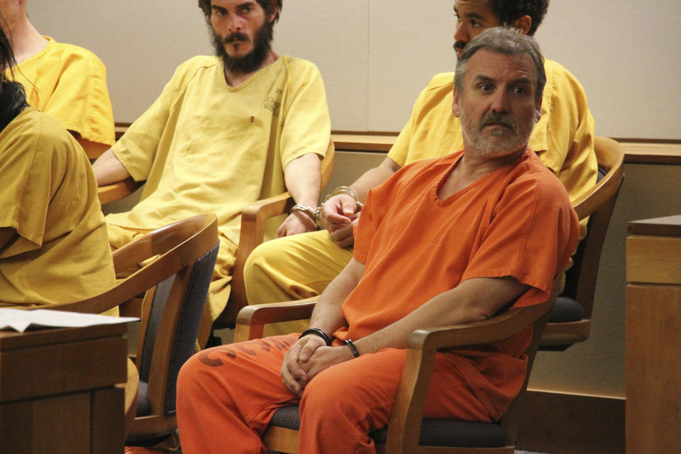 Brian Steven Smith sits in a courtroom in Anchorage, Alaska, Monday, Oct. 21, 2019. Smith entered an innocent plea Monday in an Anchorage courtroom. He earlier pleaded not guilty in the death of 30-year-old Kathleen Henry, a homeless Alaska Native woman. During his interrogation, police say he confessed to killing another Alaska Native woman. Police won't say if there may be other victims. (AP Photo/Mark Thiessen)