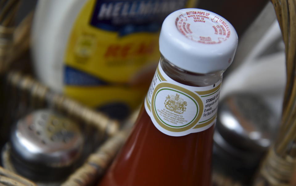 Queen  A royal warrant is seen printed on a bottle of tomato sauce, manufactured by food company Heinz, at a cafe in central London, Britain, August 21, 2015. Every year Queen Elizabeth grants about 20 royal warrants, the gold emblem of the British monarchy, in a practice dating back to medieval times. The warrant holders can display the certificate and use the royal coat of arms in their marketing. The warrants lasting five years can help businesses break into new markets overseas, using their role as supplier to the royal family as a gauge of quality. On September 9, Queen Elizabeth will overtake Queen Victoria as Britain's longest-serving monarch. Picture taken August 21, 2015. REUTERS/Toby Melville
