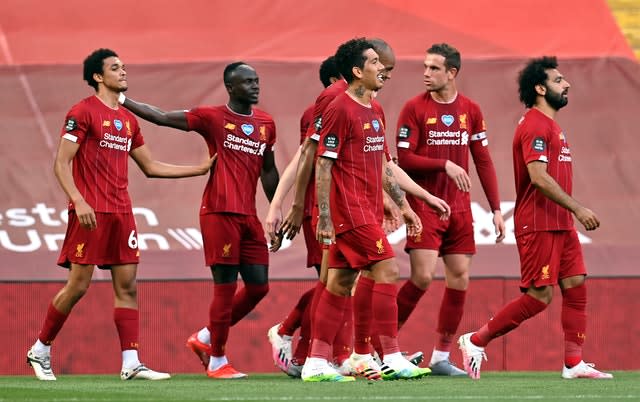 Trent Alexander-Arnold (left) celebrates scoring in the win over Crystal Palace before the title was sealed the following day 