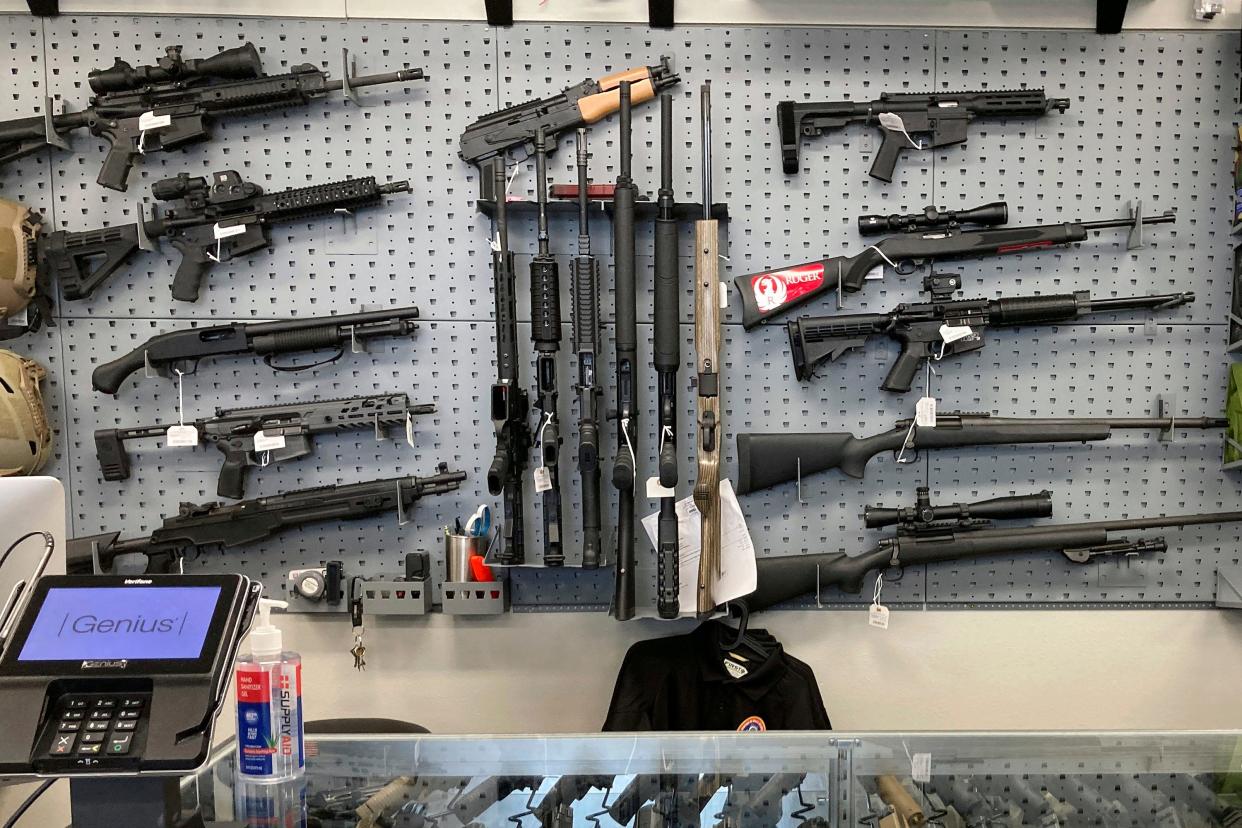 Firearms are displayed at a gun shop in Salem, Ore., on Feb. 19, 2021.