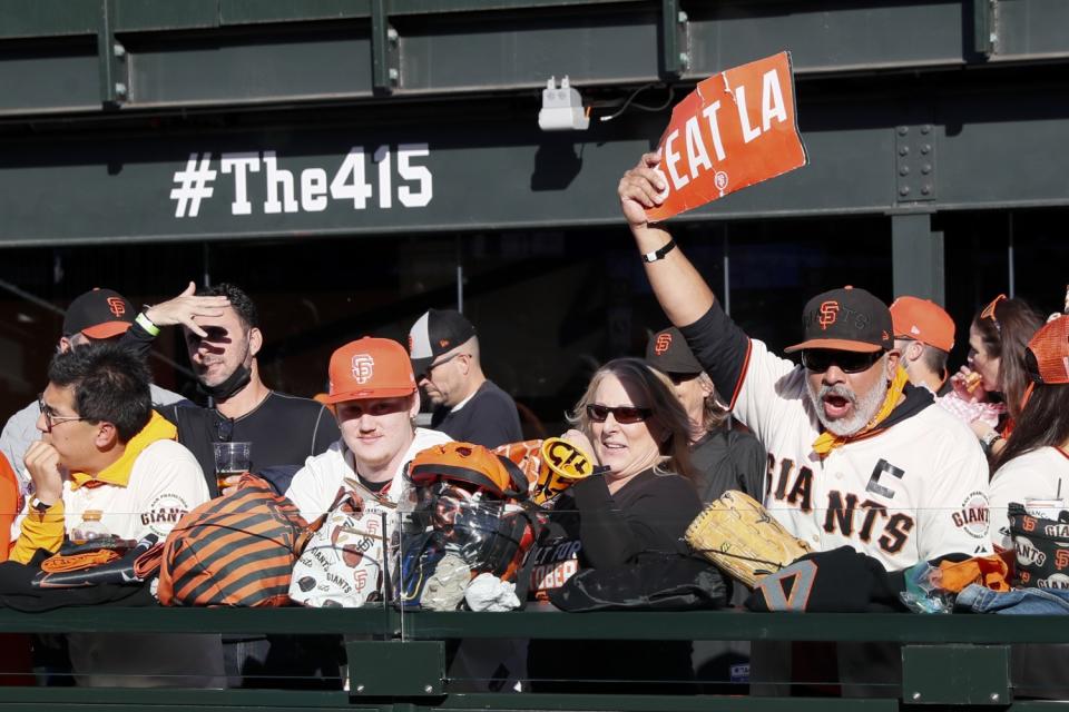 San Francisco Giants fans watch warmups before Game 5.