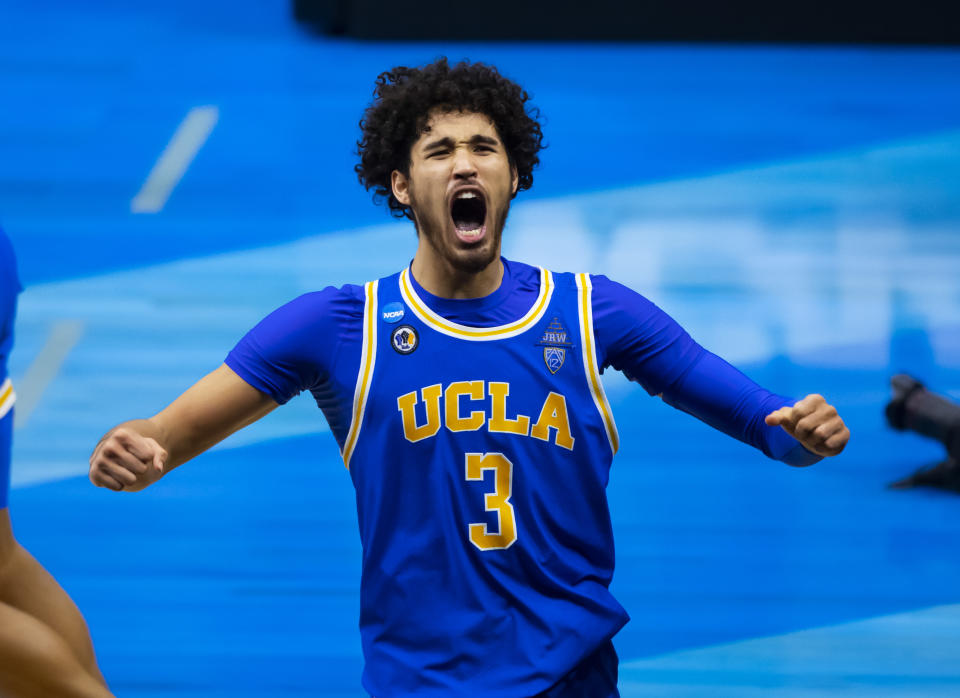 Mar 30, 2021; Indianapolis, IN, USA; UCLA Bruins guard Johnny Juzang (3) celebrates after advancing to the Final Four following their win in the Elite Eight of the 2021 NCAA Tournament against the Michigan Wolverines at Lucas Oil Stadium. 