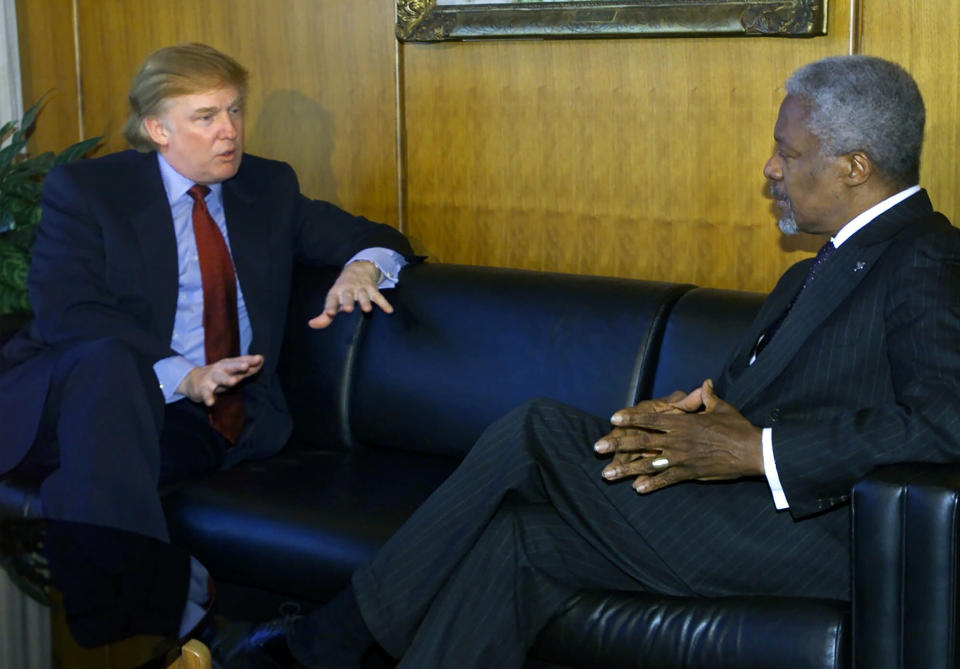 FILE - In this Jan. 9, 2001, file photo, Donald Trump, right, meets with Secretary-General Kofi Annan at the United Nations. When President Donald Trump visits the United Nations building in New York, he’s not just thinking about the global challenges the world body faces, he’s still got in mind the deal that got away. More than a decade later, Trump still relives the overtures he made to rebuild the 39-story tower in the early 2000s and posits that he could have done a better job of it. (AP Photo/Suzanne Plunkett, File)