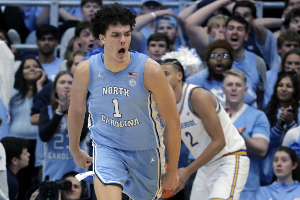 North Carolina forward Zayden High (1) celebrates after dunking over UC Riverside forward Kaleb Smith (2) during the second half of an NCAA college basketball game Friday, Nov. 17, 2023, in Chapel Hill, N.C. (AP Photo/Chris Seward)