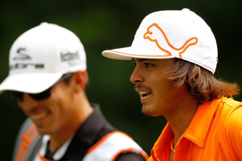 CHARLOTTE, NC - MAY 06: Rickie Fowler (R) of the United States laughs alongside caddie Joseph Skovron (L) on the 12th tee during the final round of the Wells Fargo Championship at the Quail Hollow Club on May 6, 2012 in Charlotte, North Carolina. (Photo by Streeter Lecka/Getty Images)