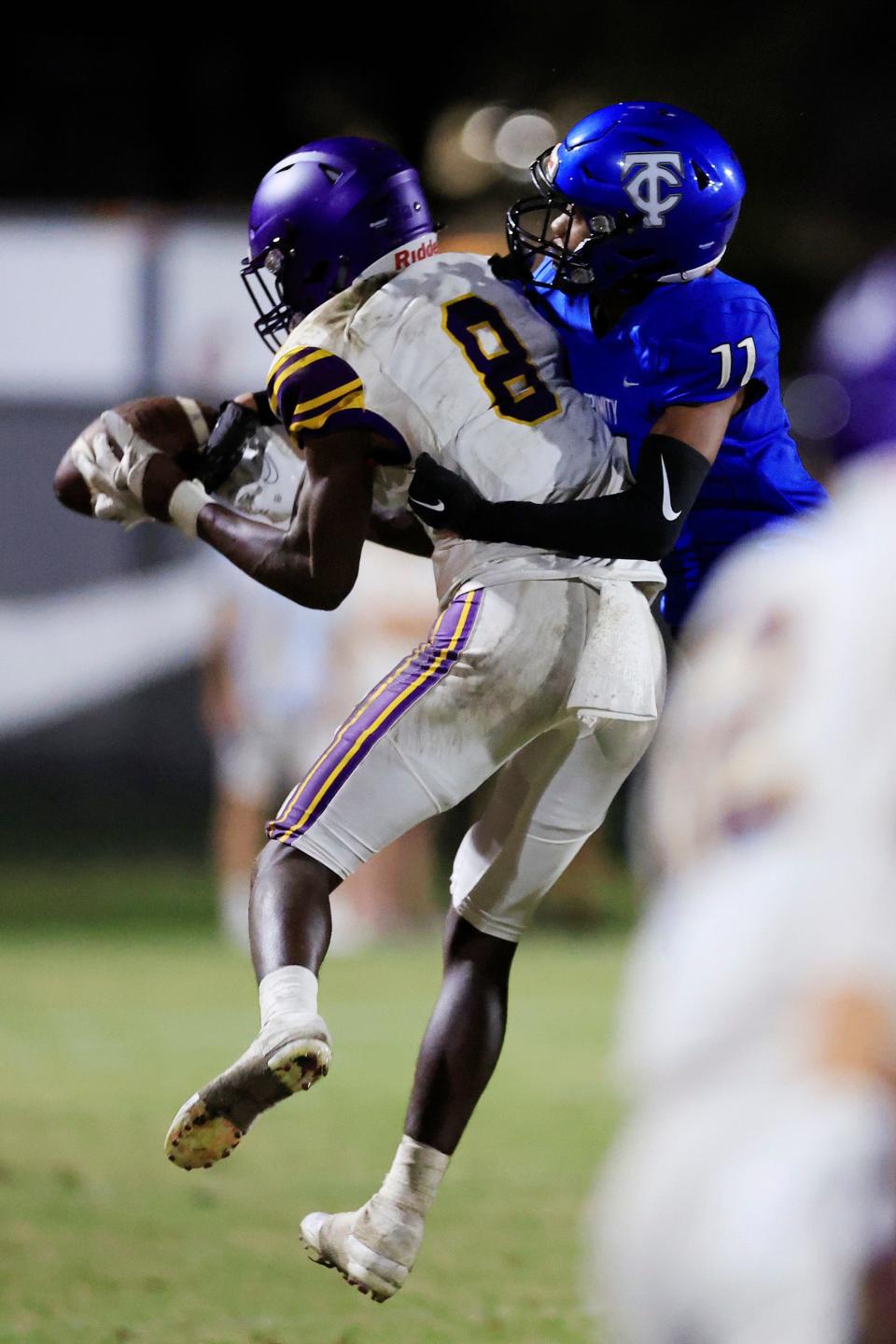 Trinity Christian Academy's Tre Stewart (11) forces an incomplete pass against Columbia's Jaylen Cooper (8) during the fourth quarter of a regular season football game Friday, Sept. 23, 2022 at Trinity Christian Academy in Jacksonville. Trinity Christian Academy defeated the Columbia Tigers 43-30.  