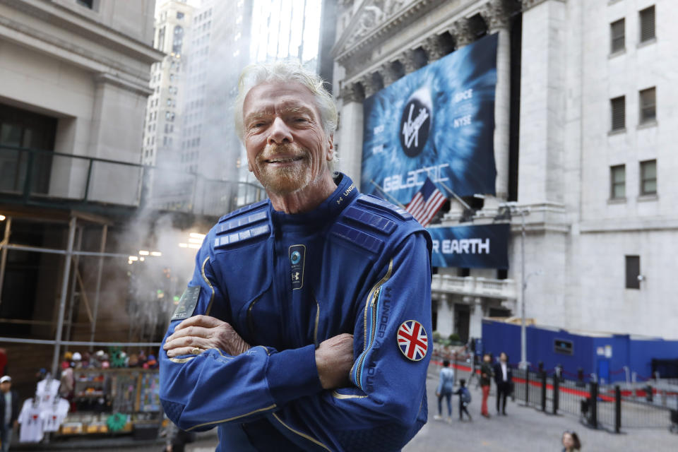 Sir Richard Branson, founder of Virgin Galactic, poses for a photo outside the New York Stock Exchange before his company's IPO, Monday, Oct. 28, 2019. (AP Photo/Richard Drew)