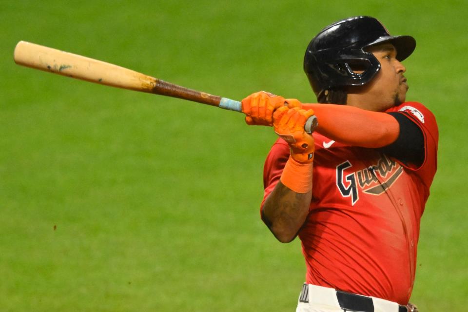 Cleveland Guardians slugger Jose Ramirez (11) hits a three-run home run in the eighth inning against the Cincinnati Reds on Wednesday in Cleveland.