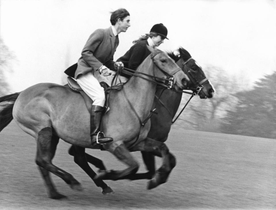 Prince Charles and Princess Anne riding horses in Windsor Great Park in 1969.