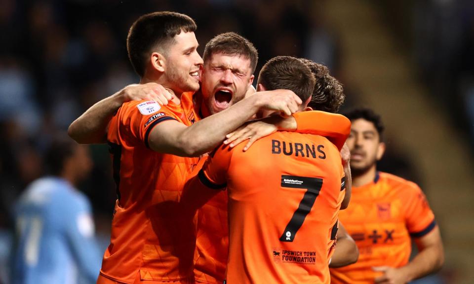 <span>Cameron Burgess celebrates with teammates after he put Ipswich back in front at the CBS Arena.</span><span>Photograph: Naomi Baker/Getty Images</span>