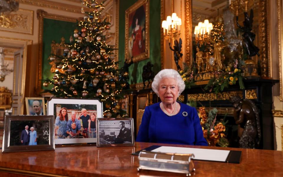 Queen Elizabeth II posing for a photograph after she recorded her annual Christmas Day message, in Windsor Castle last year  - STEVE PARSONS 