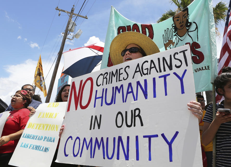 <p>Stefanie Herweck stands with other protesters in front of the U.S. Customs and Border Protection’s Rio Grande Valley Sector’s Centralized Processing Center on June 17, 2018, in McAllen, Texas. (Photo: Joel Martinez/The Monitor via AP) </p>