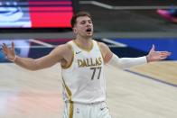 Dallas Mavericks' Luka Doncic (77) gestures after missing on a 3-point shot attempt in the first half of an NBA basketball game against the Denver Nuggets in Dallas, Monday, Jan. 25, 2021. (AP Photo/Tony Gutierrez)