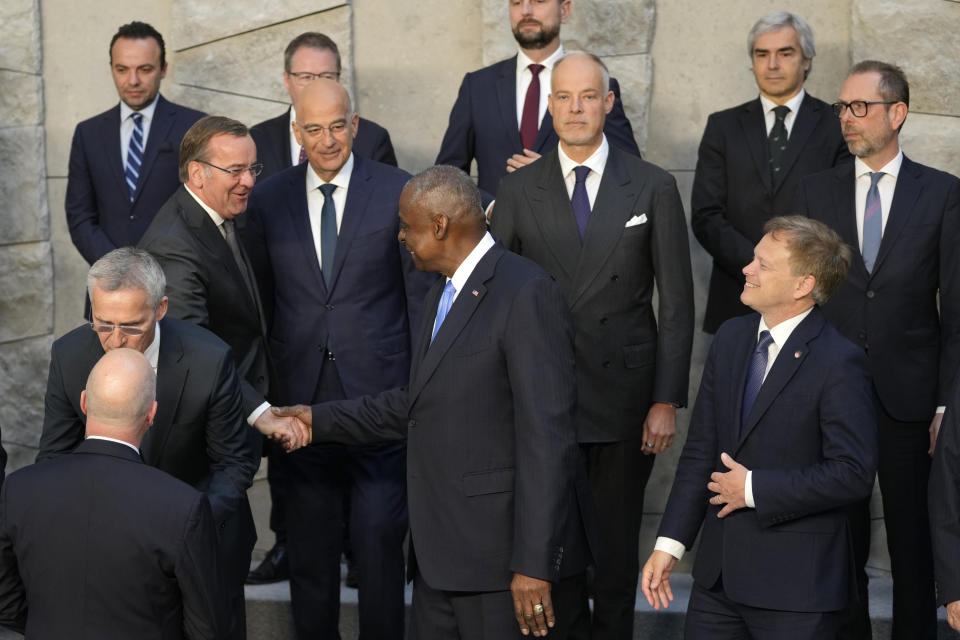 United States Secretary of Defense Lloyd Austin, front center, shakes hands with Germany's Defense Minister Boris Pistorius, center row left, during a group photo of NATO defense ministers at NATO headquarters in Brussels, Friday, June 14, 2024. (AP Photo/Virginia Mayo)