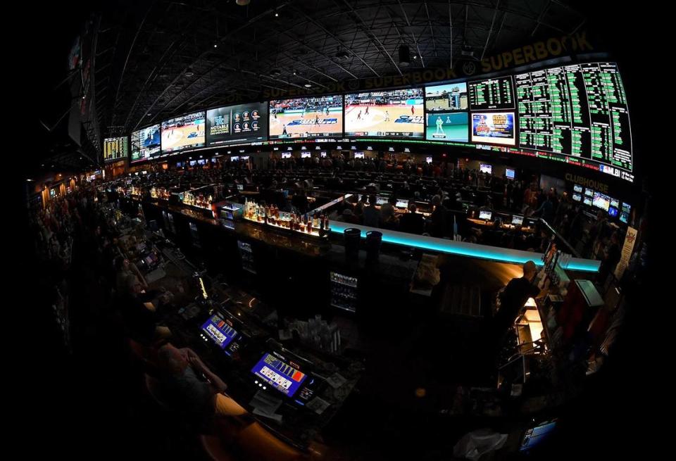 Guests attend a viewing party for the NCAA men’s basketball tournament inside the 25,000-square-foot Race & Sports SuperBook facility at the Westgate Las Vegas Resort & Casino in Las Vegas on March 15, 2018. “There will be a place for brick and mortar for UK basketball games and NFL football games (at Red Mile),” said Jim Goodman, director of wagering development at Keeneland. Ethan Miller/TNS