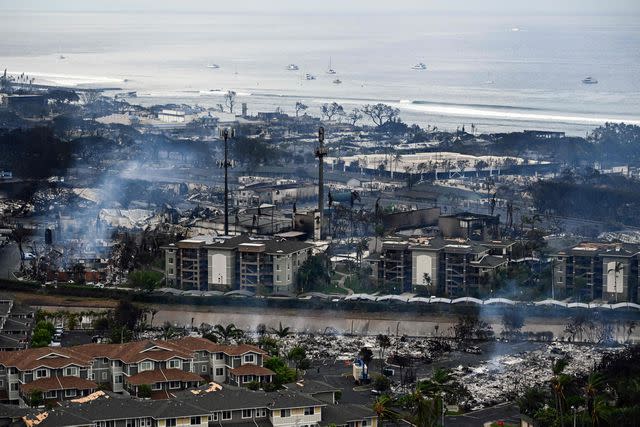 <p>PATRICK T. FALLON/AFP via Getty</p> An aerial image taken on August 10, 2023 shows destroyed homes and buildings burned to the ground in Lahaina.