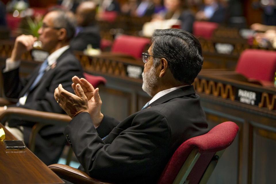 Rep. Lupe Diaz claps as Dmytro Kushneruk, consul general of Ukraine, speaks about the war with Russia during a special joint session on April 7, 2022.