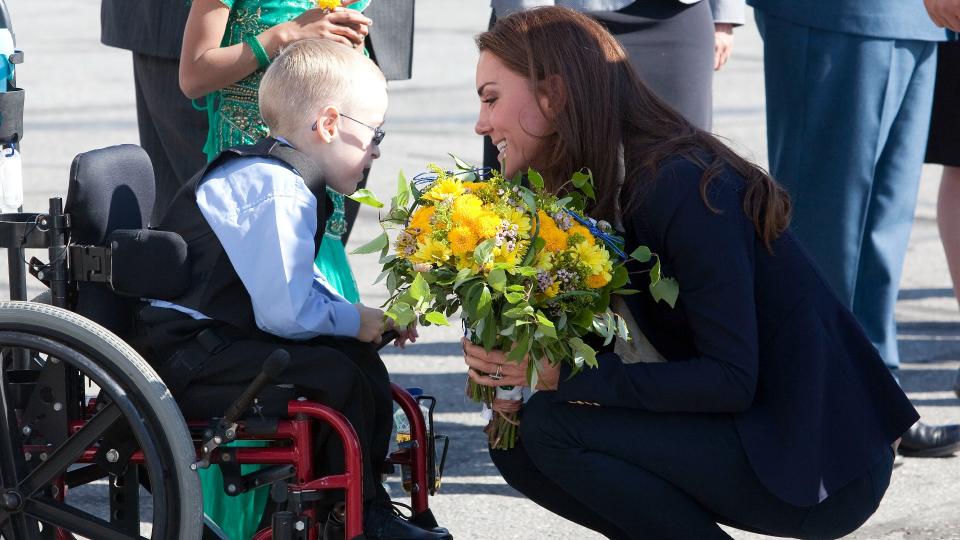 Greeting a young fan on her first ever tour