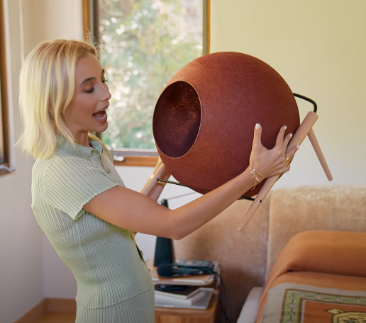 Emma holding a cat bed