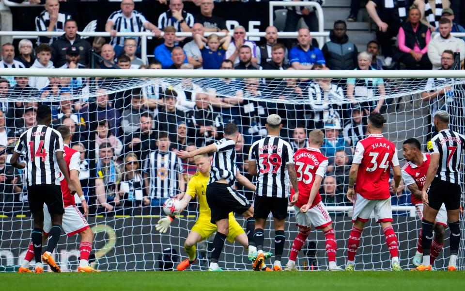 Arsenal's goalkeeper Aaron Ramsdale saves from Newcastle's Fabian Schaer - AP