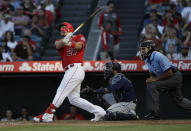 Los Angeles Angels' Mike Trout follows through on a two-run home run against the Seattle Mariners during the third inning of a baseball game Saturday, July 13, 2019, in Anaheim, Calif. (AP Photo/Marcio Jose Sanchez)