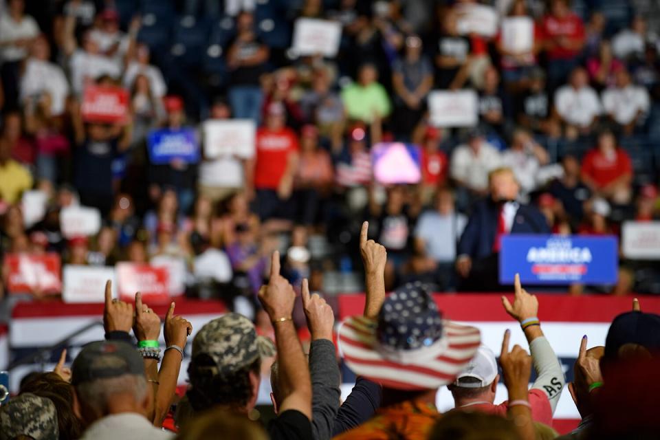 Audience members put their index finger up to symbolize America First while President Donald Trump speaks at a Save America Rally to support Republican candidates running for state and federal offices in the state of Ohio at the Covelli Centre on September 17, 2022 in Youngstown, Ohio.