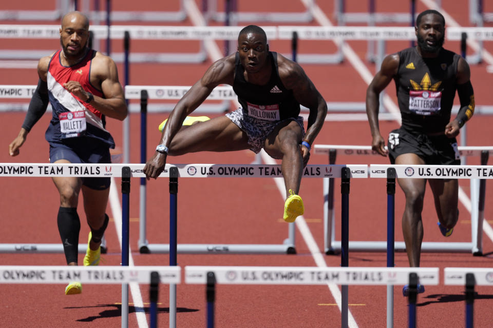 Grant Holloway wins the first heat in the men's 400-meter hurdles at the U.S. Olympic Track and Field Trials Friday, June 25, 2021, in Eugene, Ore. (AP Photo/Ashley Landis)