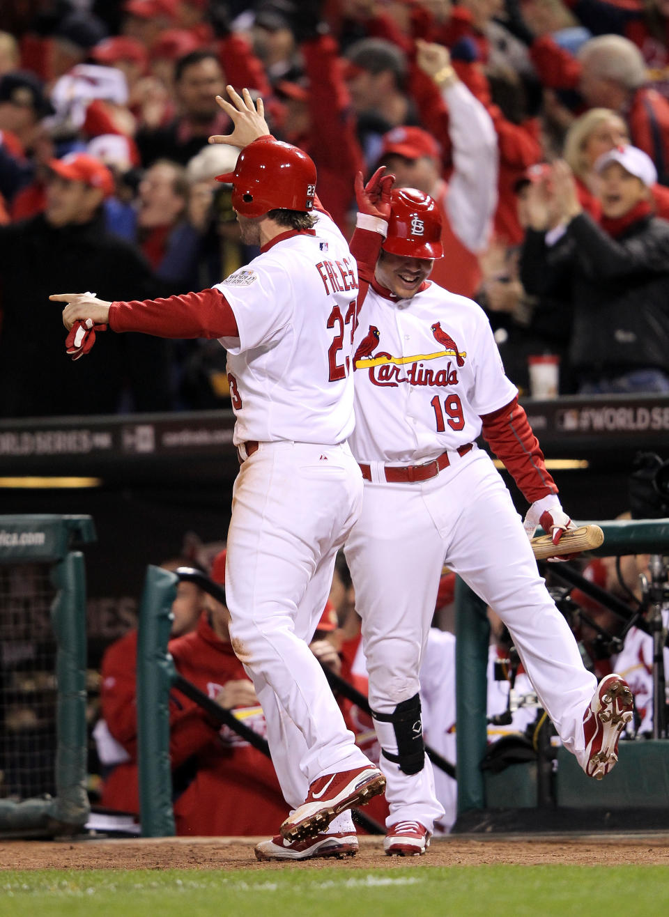 ST LOUIS, MO - OCTOBER 20: David Freese #23 and Jon Jay #19 of the St. Louis Cardinals celebrate after Freese scores on an RBI single by Allen Craig #21 in the seventh inning during Game Two of the MLB World Series against the Texas Rangers at Busch Stadium on October 20, 2011 in St Louis, Missouri. (Photo by Jamie Squire/Getty Images)