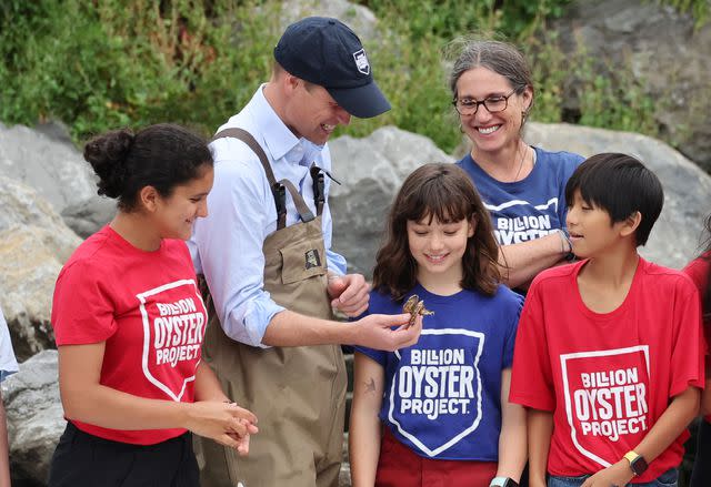 <p>Cindy Ord/Getty</p> Prince William chats with kids at the Billion Oyster Project in New York on Monday