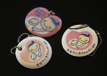 Maternity keychains made by Sayaka Osakabe, founder of "Matahara net," a support group calling for legislation outlining more support for working women, are displayed in her house in Kawasaki, south of Tokyo September 11, 2014. REUTERS/Yuya Shino