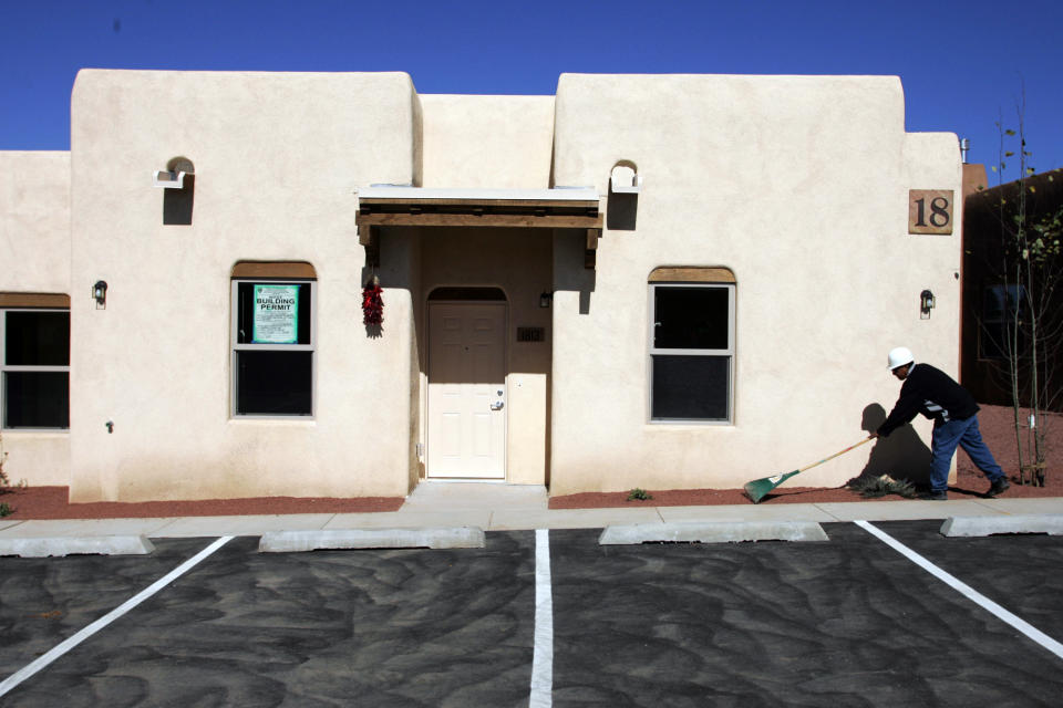 A workman puts the final touches on the front of a condo unit before the opening of Rainbowvision retirement community in Santa Fe, New Mexico. Rainbowvision is a retirement community catering to the gay, lesbian and transgender groups. The community offers condos to purchase, rentals, assisted living quarters as well as banking and other facilities. The 25 million dollar complex took 4 years from conception to opening. Two more Rainbowvision facilities are under way in Florida and California. (Photo by Steven Clevenger/Corbis via Getty Images)