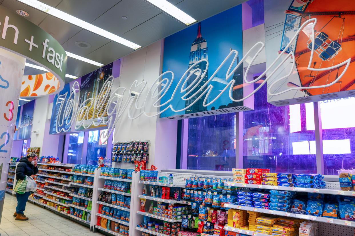 A person is seen shopping in Walgreens, owned by the Walgreens Boots Alliance, Inc., in Manhattan, New York City, U.S., November 26, 2021. REUTERS/Andrew Kelly