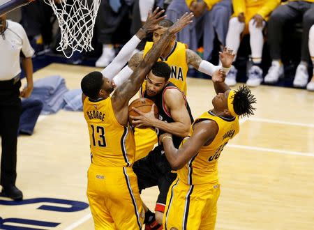 Apr 21, 2016; Indianapolis, IN, USA; Toronto Raptors guard Cory Joseph (6) is guarded by Indiana Pacers forward Paul George (13) and center Myles Turner (33) in the second half in game three of the first round of the 2016 NBA Playoffs at Bankers Life Fieldhouse. Toronto defeated Indiana 101-85. Brian Spurlock-USA TODAY Sports