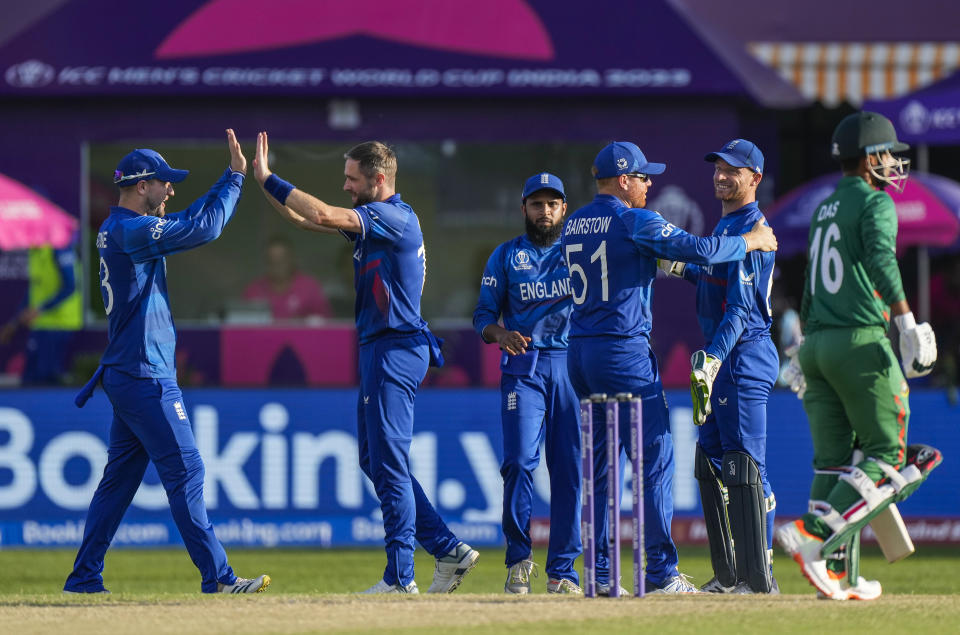 England's Chris Woakes celebrates the wicket of Bangladesh's Litton Das during the ICC Men's Cricket World Cup match between England and Bangladesh in Dharamshala, India, Tuesday, Oct. 10, 2023. (AP Photo/Ashwini Bhatia)