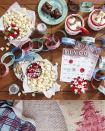 <p>Think outside the dining room! From a ticket garland to theater-candy brownies, this cozy flick-themed gathering (complete with <a href="https://www.countryliving.com/life/entertainment/a34555161/christmas-bingo/" rel="nofollow noopener" target="_blank" data-ylk="slk:downloadable bingo cards;elm:context_link;itc:0;sec:content-canvas" class="link ">downloadable bingo cards</a>) makes movie viewing more memorable. Vintage cookie tins make festive individual popcorn “bowls.” Set out a selection of comfy pillows and warm blankets for snuggling up while viewing.</p><p><a class="link " href="https://www.amazon.com/Containers-Christmas-Festive-Holiday-Snowflake/dp/B09H3CW5G3/ref=sr_1_1_sspa?tag=syn-yahoo-20&ascsubtag=%5Bartid%7C10050.g.644%5Bsrc%7Cyahoo-us" rel="nofollow noopener" target="_blank" data-ylk="slk:Shop Now;elm:context_link;itc:0;sec:content-canvas">Shop Now</a></p>